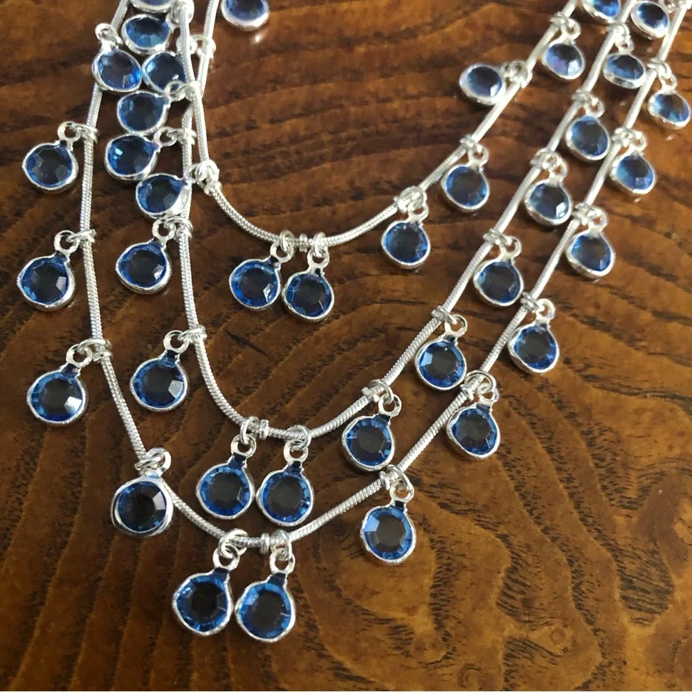 Vintage Anne Klein lion triple strand framed blue crystal dangle necklace